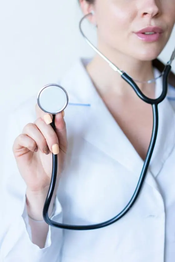 A doctor holding a stethoscope