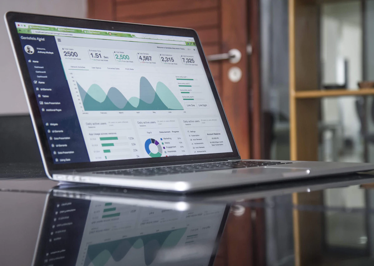 Laptop on a desk displaying website performance charts used to check search rankings