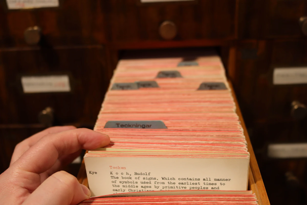Wooden card catalog drawers in a public library, a real-world version of a search engine index