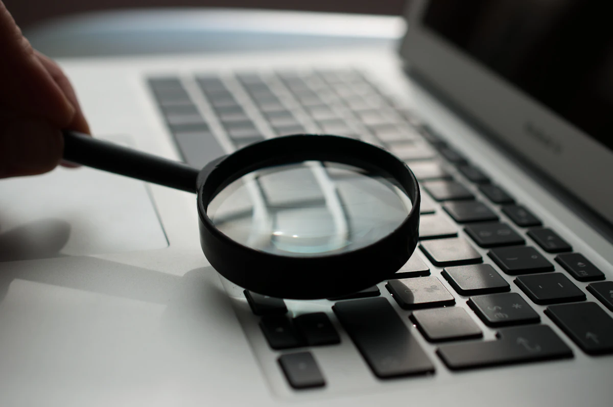Laptop on a desk with a search page open, used to review results before filing a Google removal request